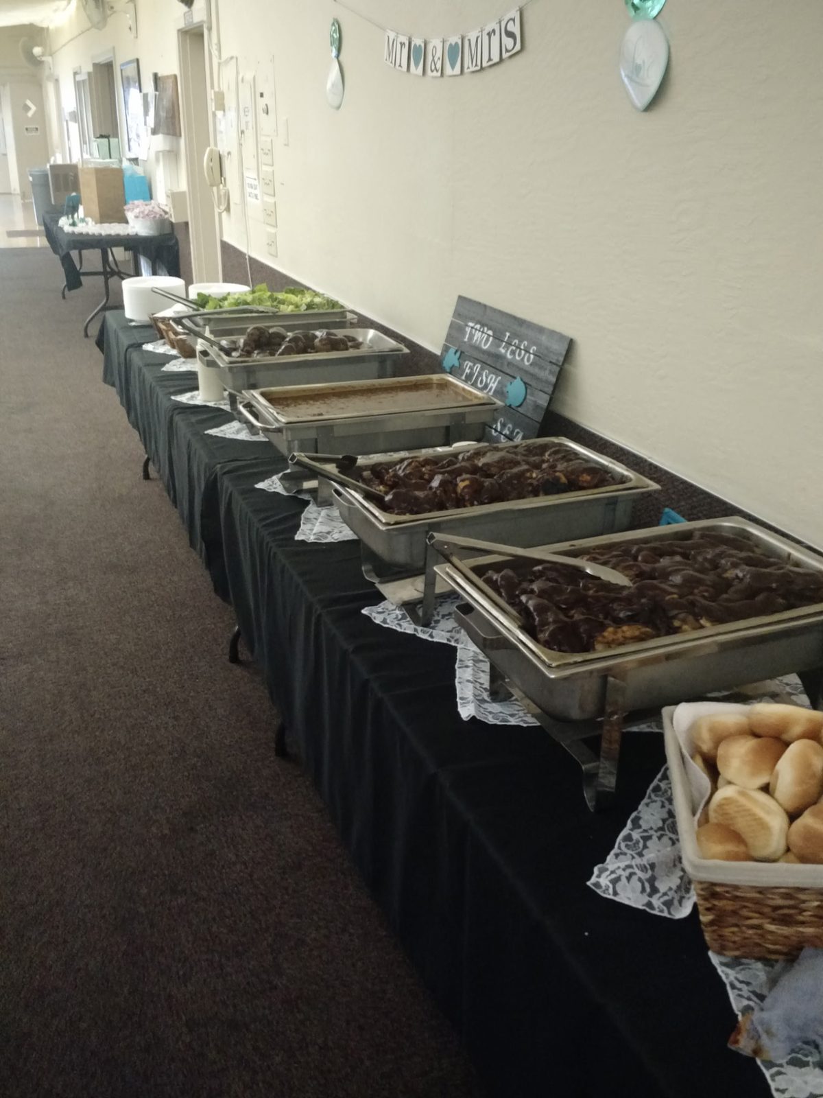 Mr and Mrs wedding buffet — chafing dishes of glazed chicken and ribs with dinner rolls